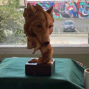 Wolf carrying her cub